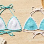 White and aqua mercerized cotton crochet bikini top colorways with picot borders laid flat on travertine stone