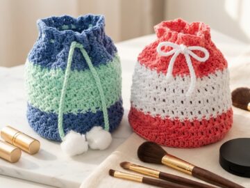 Two-color drawstring crochet makeup bag pattern in denim-mint and coral-white on a modern marble vanity