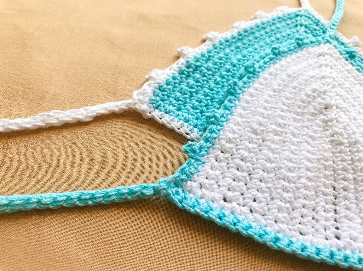 Macro close-up of the 3-chain picot border and slip-stitched ch-75 back tie strap on the crochet bikini top