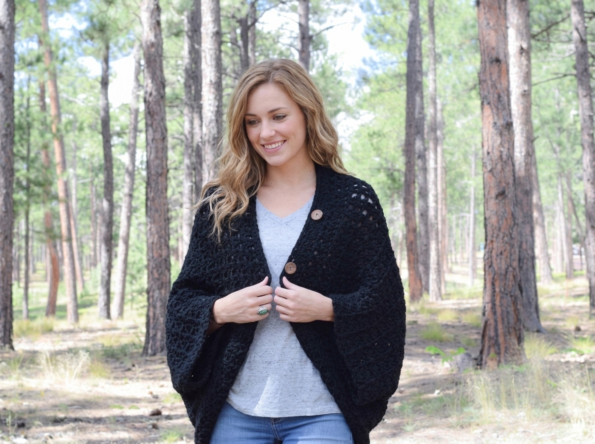 Black V-stitch cocoon blanket sweater with wooden buttons